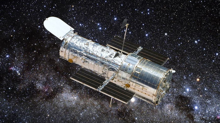 Сталкивающиеся галактики образовали эффектный треугольник на снимке Хаббла (фото)